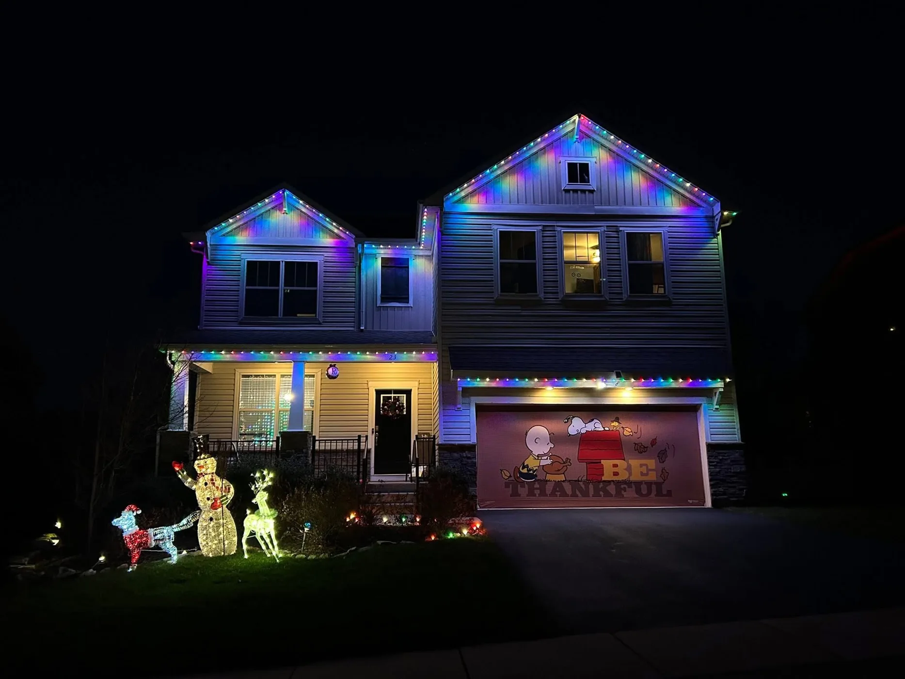 Multicolor roofline lighting on a two-story home